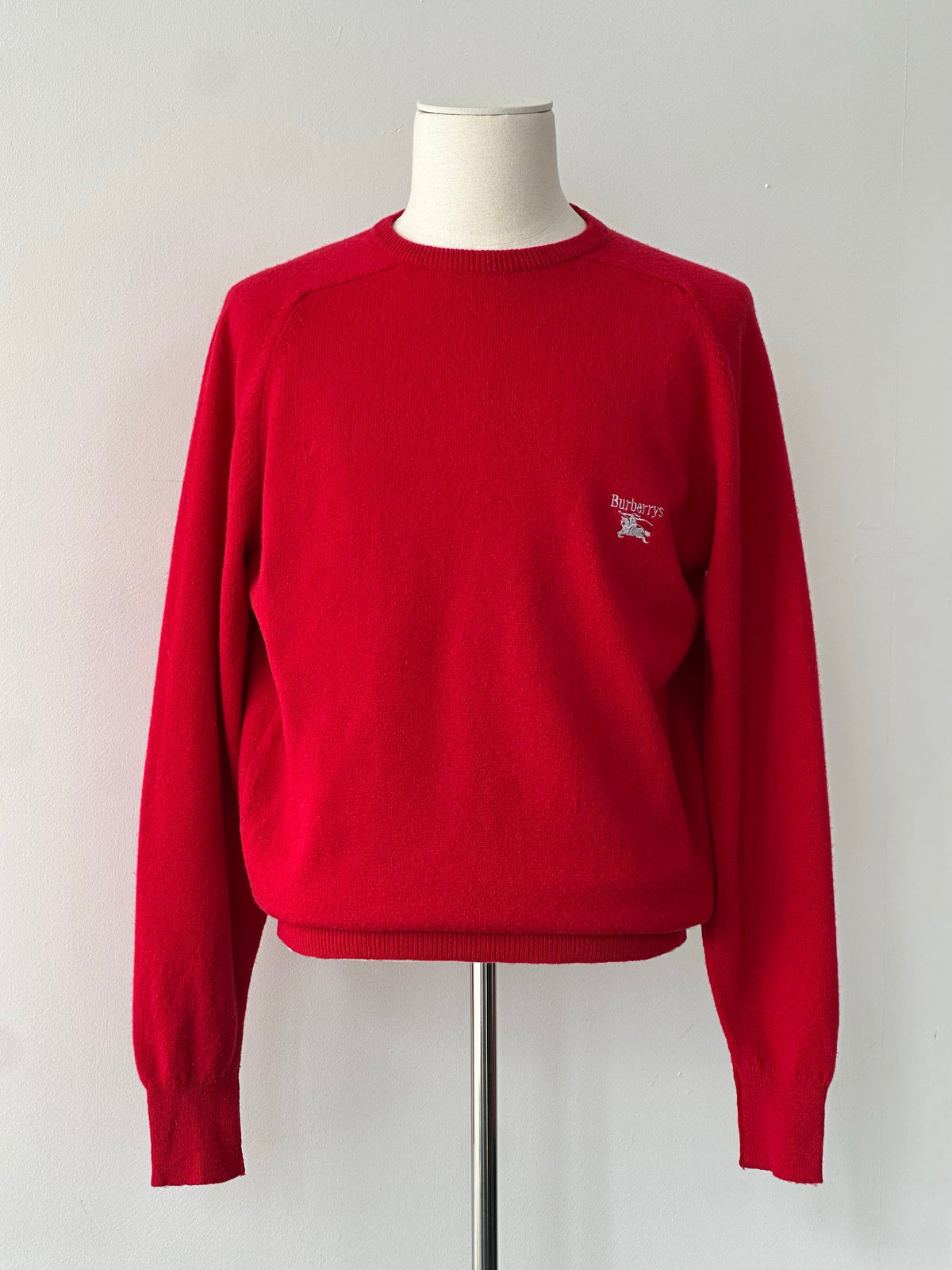 Burberry 1990s pure lambswool logo knit jumper in beige, featuring classic Burberry check logo and ribbed cuffs.