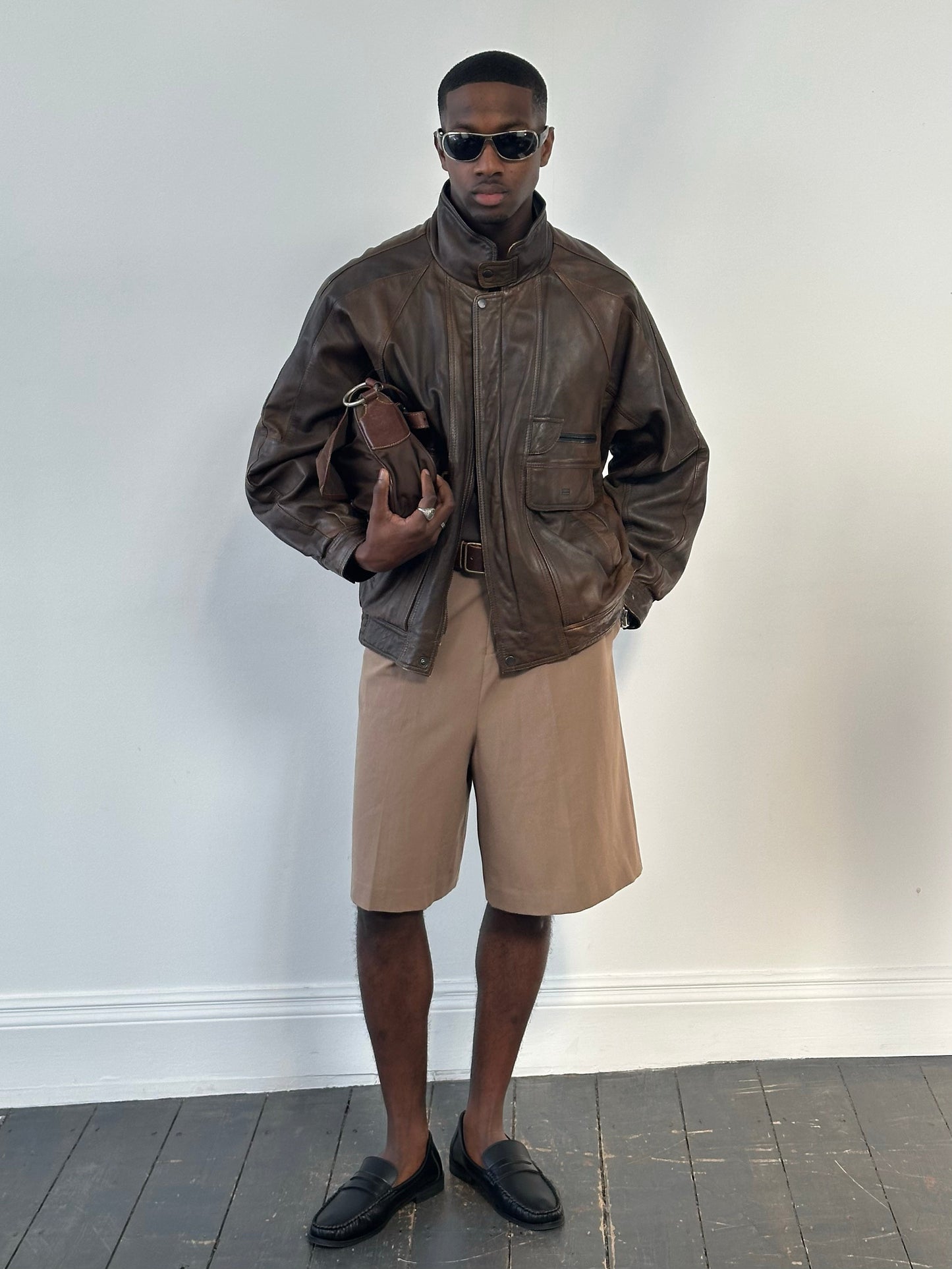Vintage 1990s leather high neck bomber jacket with XL size, featuring classic leather material and retro design.