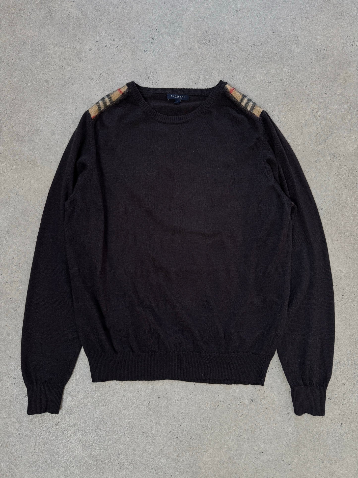 Burberry London 2000s wool knit jumper in size M, featuring classic check pattern and cozy, textured wool fabric.