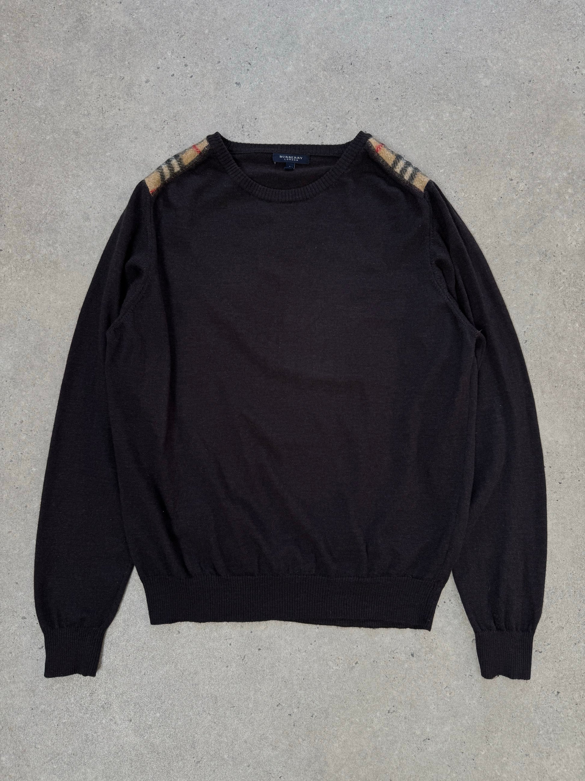Burberry London 2000s wool knit jumper in size M, featuring classic check pattern and cozy, textured wool fabric.