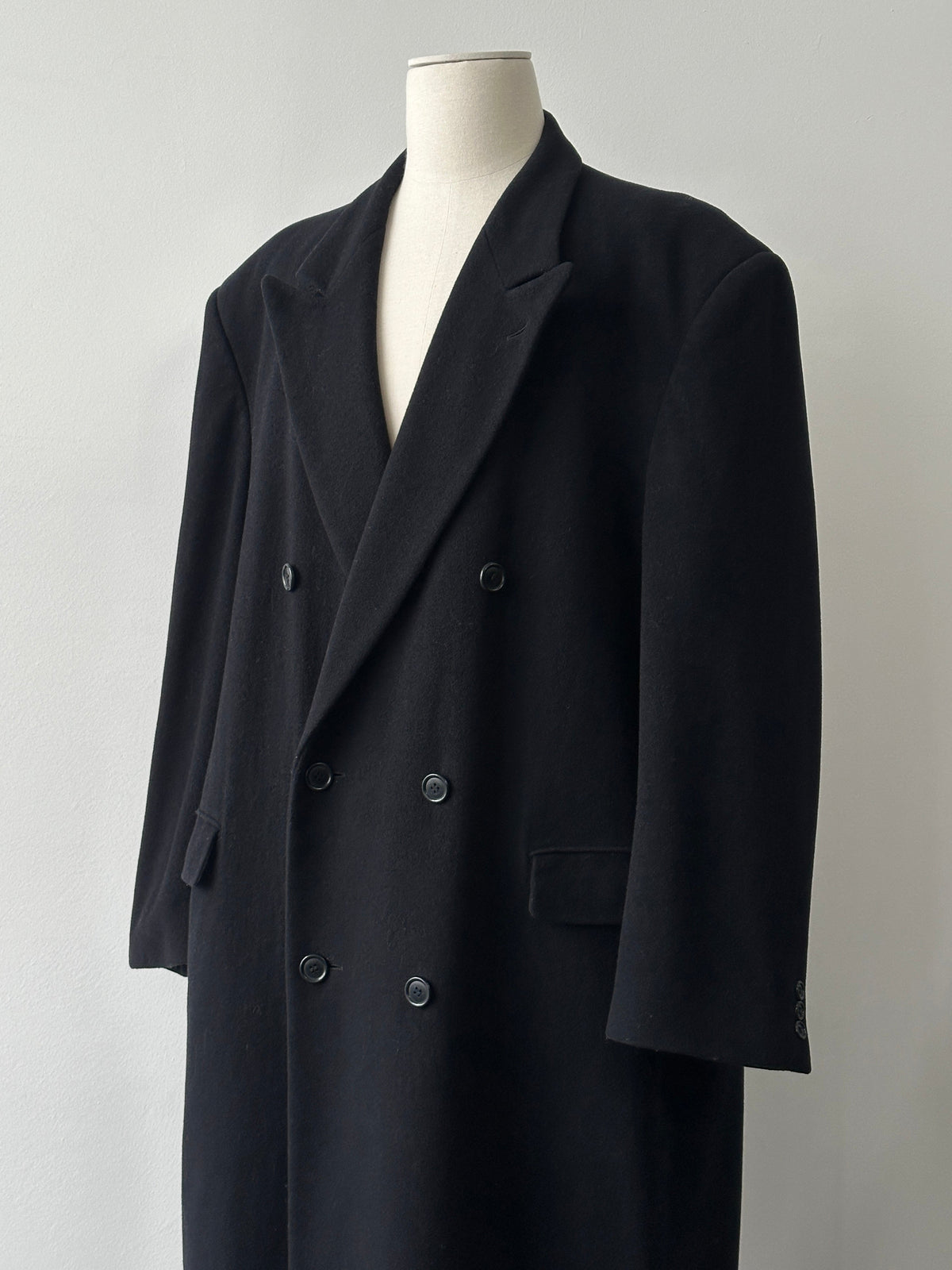 Pierre Cardin 1990s wool cashmere double-breasted coat in XXL, shown hanging with classic design and textured fabric details.