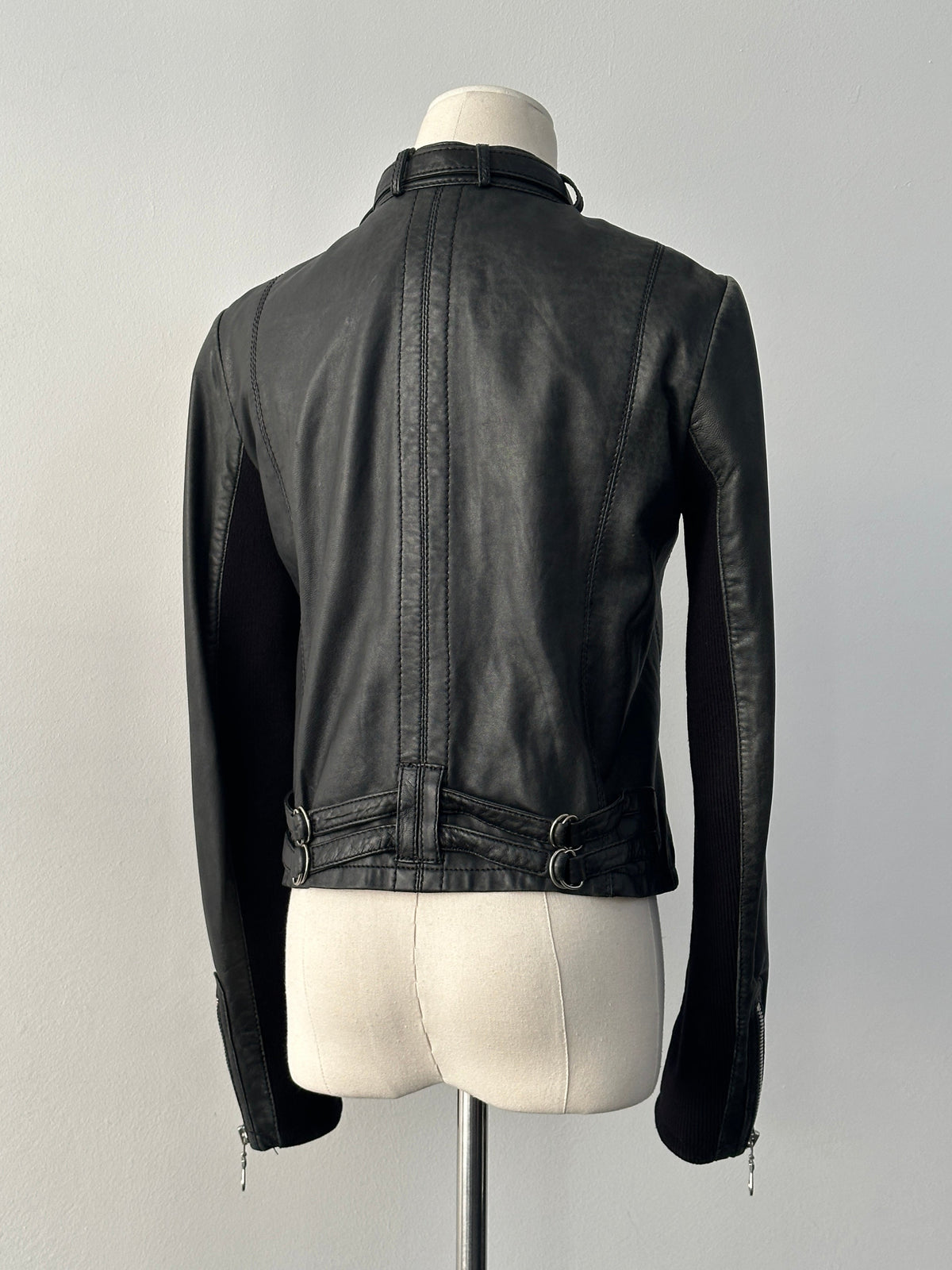 Vintage 2000s fitted moto leather jacket in black lamb leather, showcasing classic style with a slim fit design.