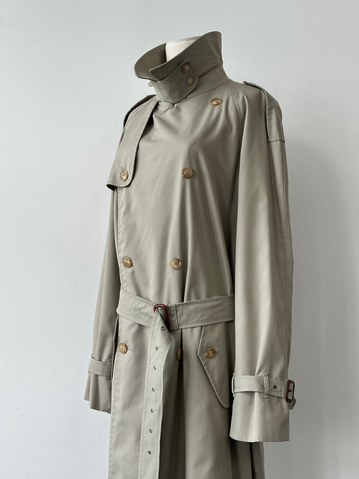 Vintage Italian 1990s high neck belted trench coat in XL, showcasing classic style and textured fabric.