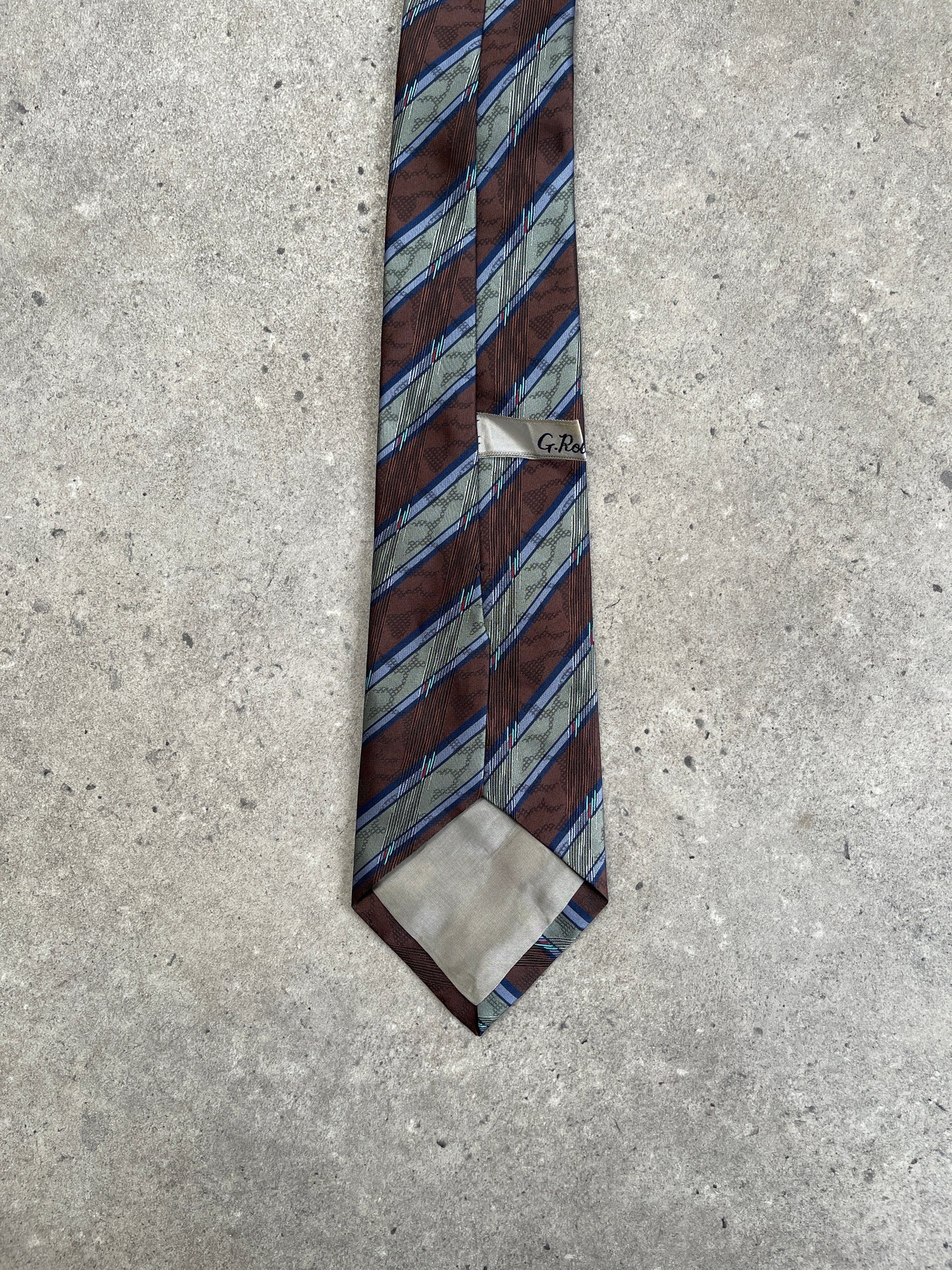 Vintage 1980s diagonal striped tie, classic men's accessory with bold pattern and retro style, made by Vintage brand.