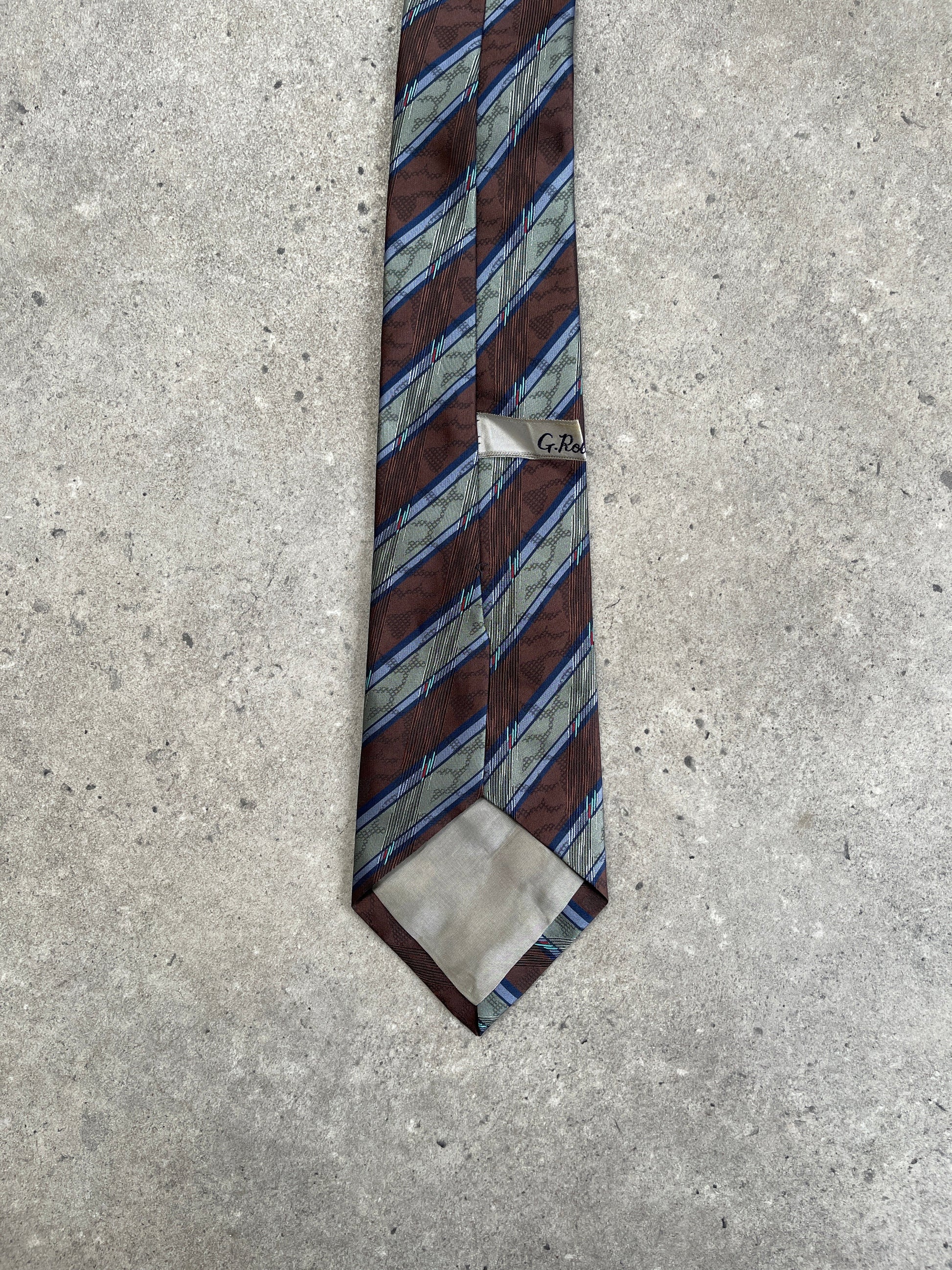 Vintage 1980s diagonal striped tie, classic men's accessory with bold pattern and retro style, made by Vintage brand.