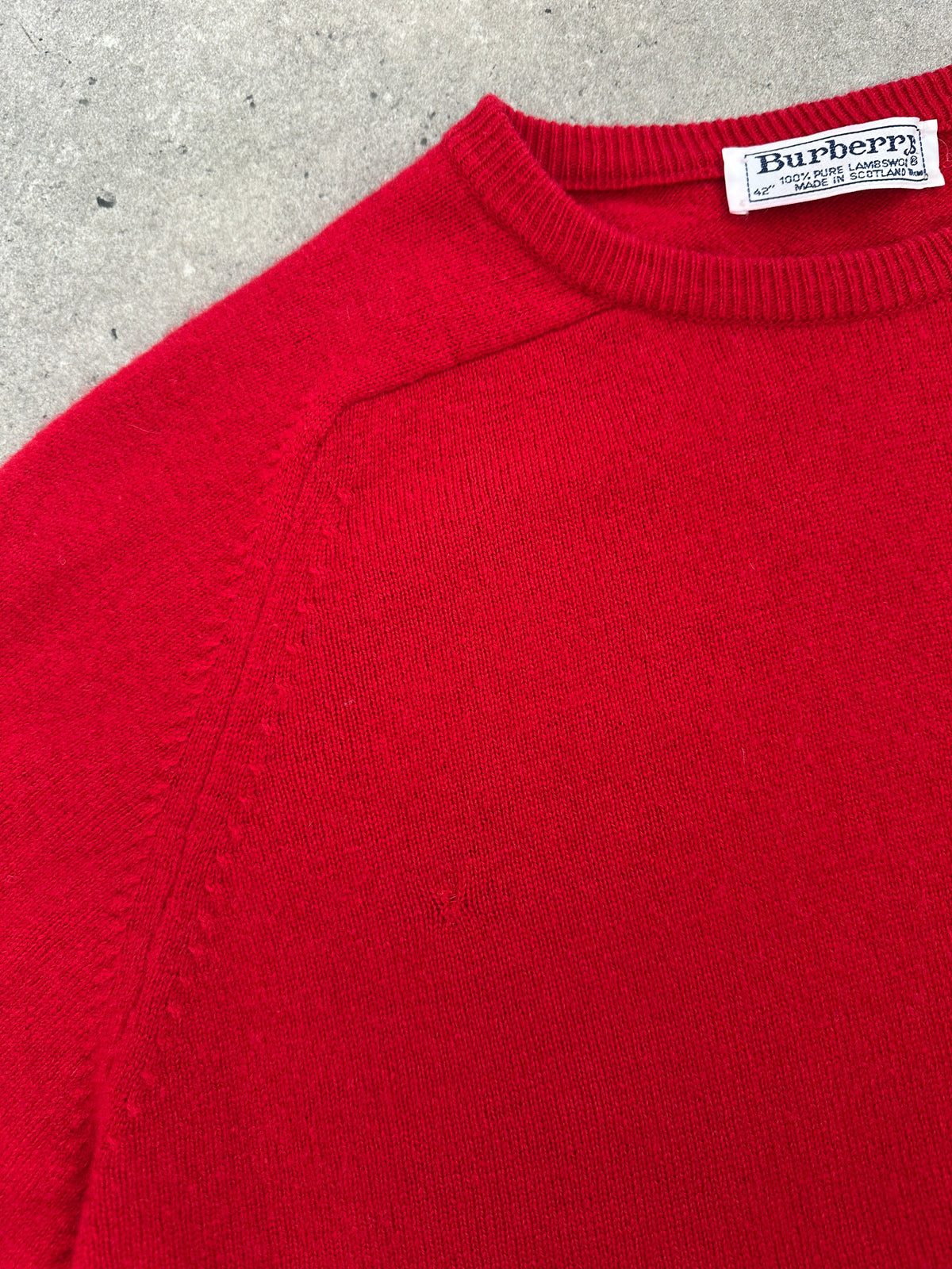 Burberry 1990s pure lambswool logo knit jumper in size M, featuring the iconic Burberry pattern and classic ribbed cuffs.