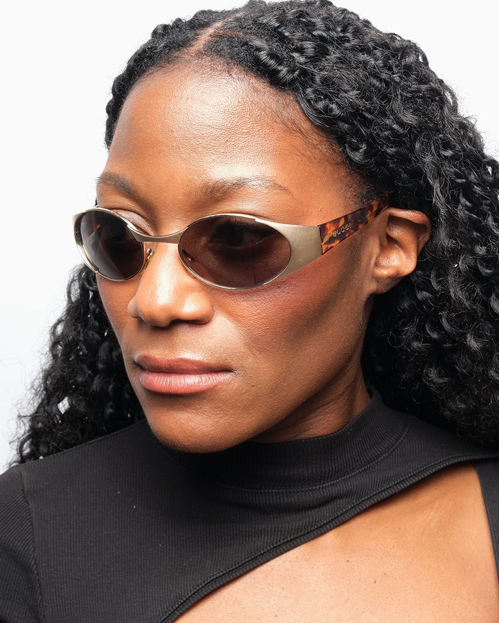 https://cdn.shopify.com/s/files/1/0818/5459/5398/files/1990s-gucci-sunglasses-422100.jpg?v=1739180683