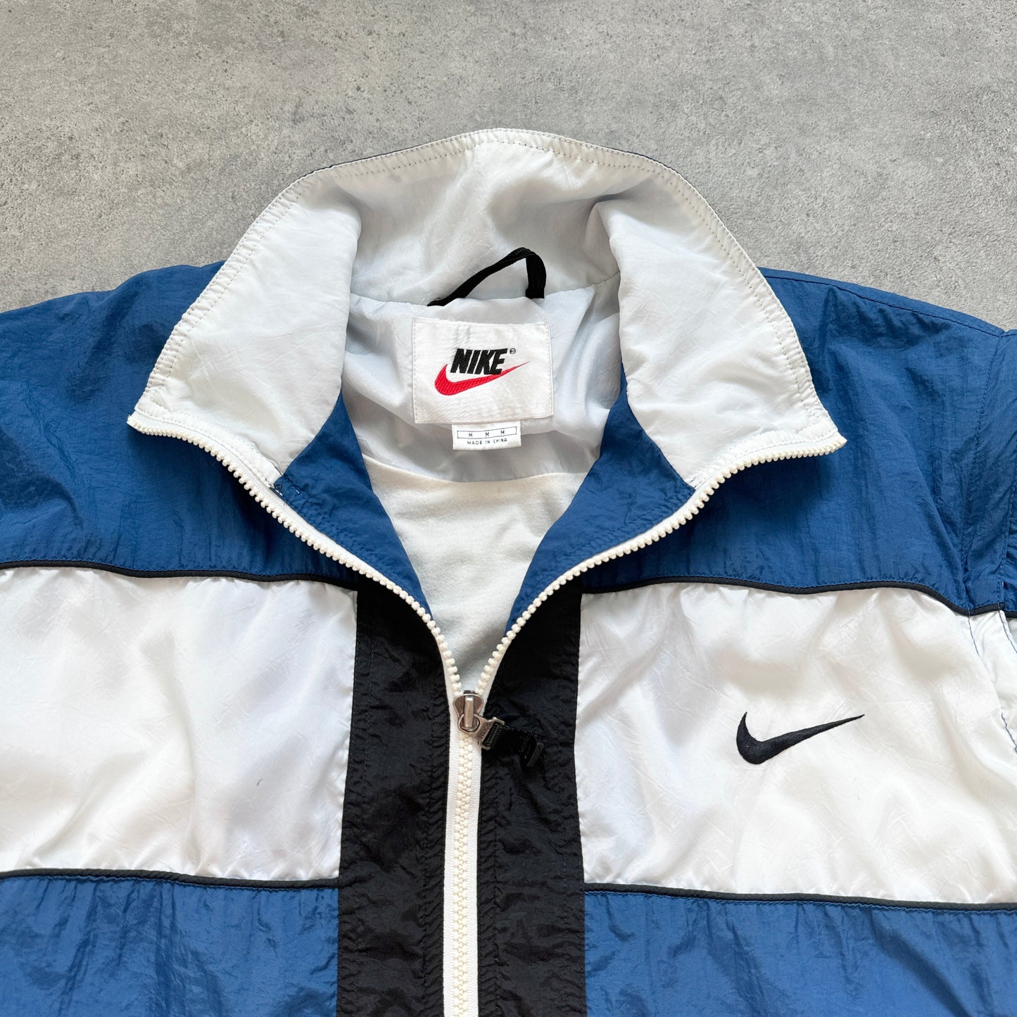 Nike 1990s lightweight convertible spellout shell jacket (M)