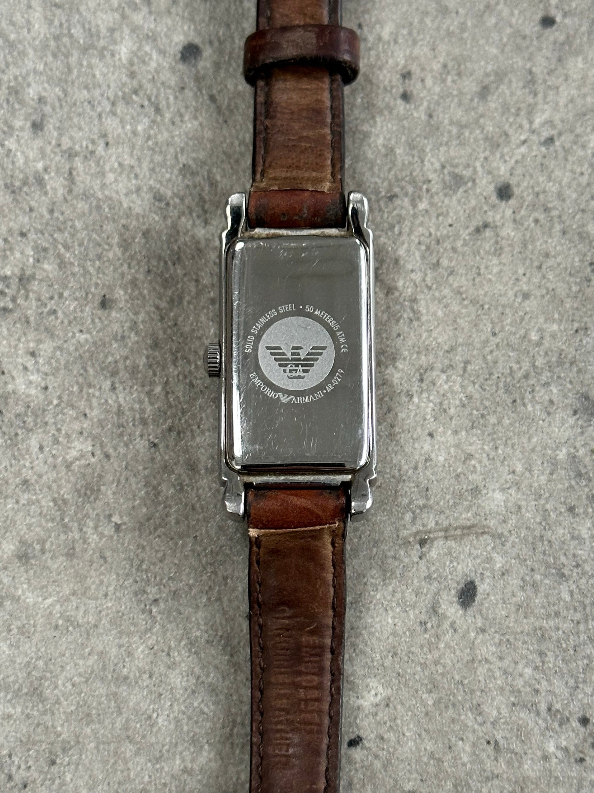 Emporio Armani 2000s leather watch with round dial and black leather strap, showcasing classic design and elegant style.