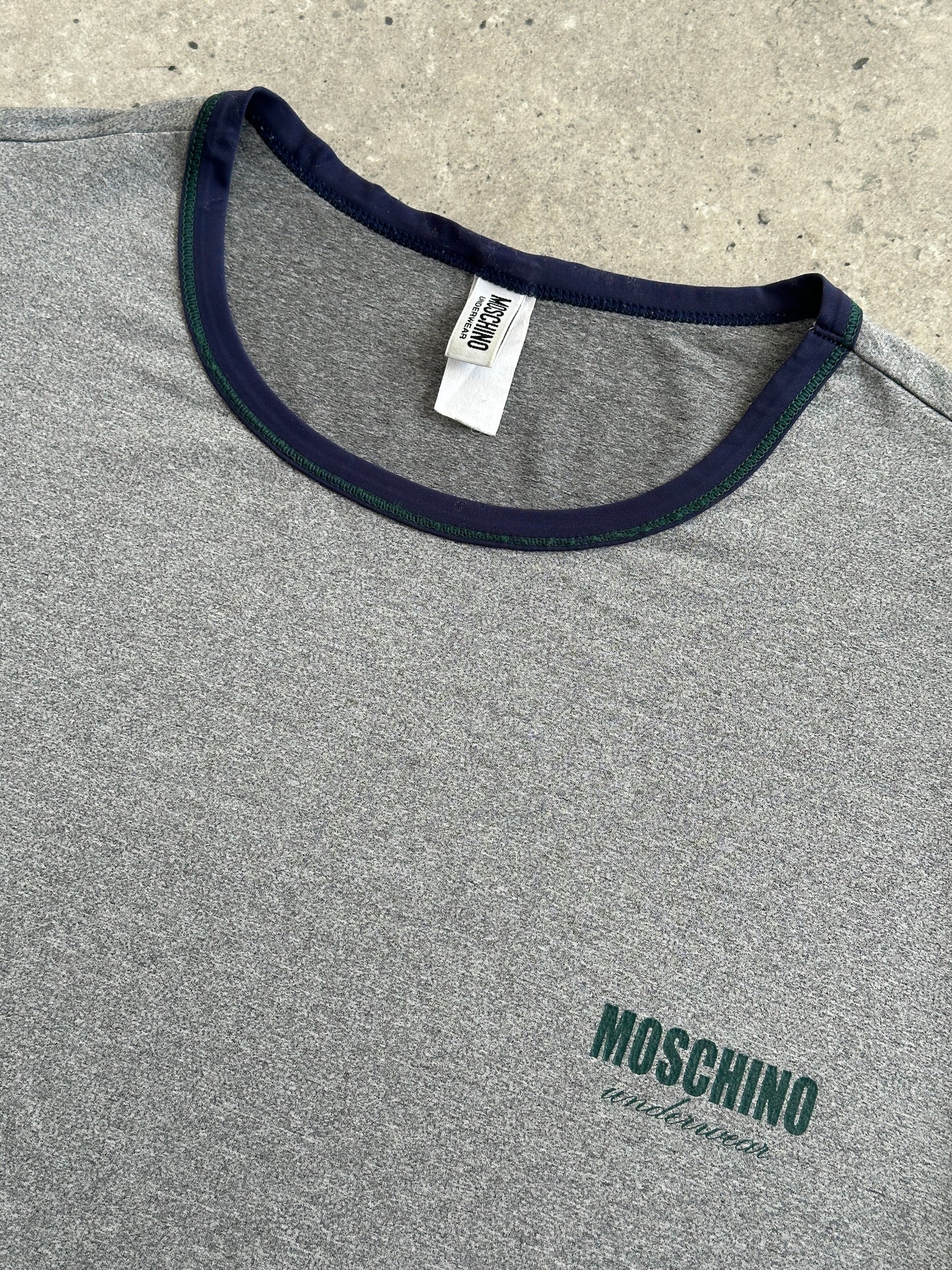 Moschino 1990s short sleeve tank top, men's underwear-inspired design, beige fabric, casual vintage style, front view.