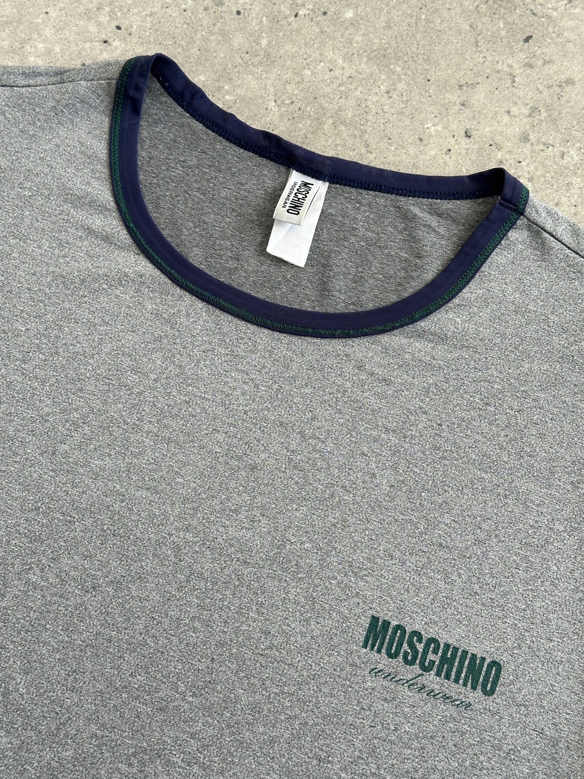 Moschino 1990s short sleeve tank top, men's underwear-inspired design, beige fabric, casual vintage style, front view.