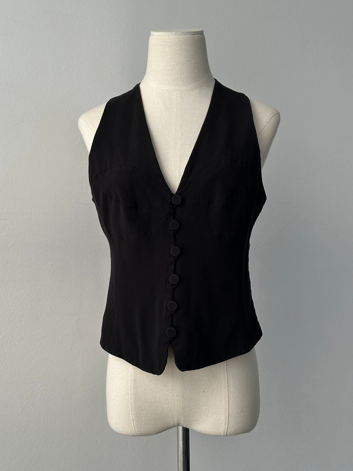 Emporio Armani 1990s fitted tailored single-button waistcoat in dark fabric, classic men's style with sleek lapel detail.
