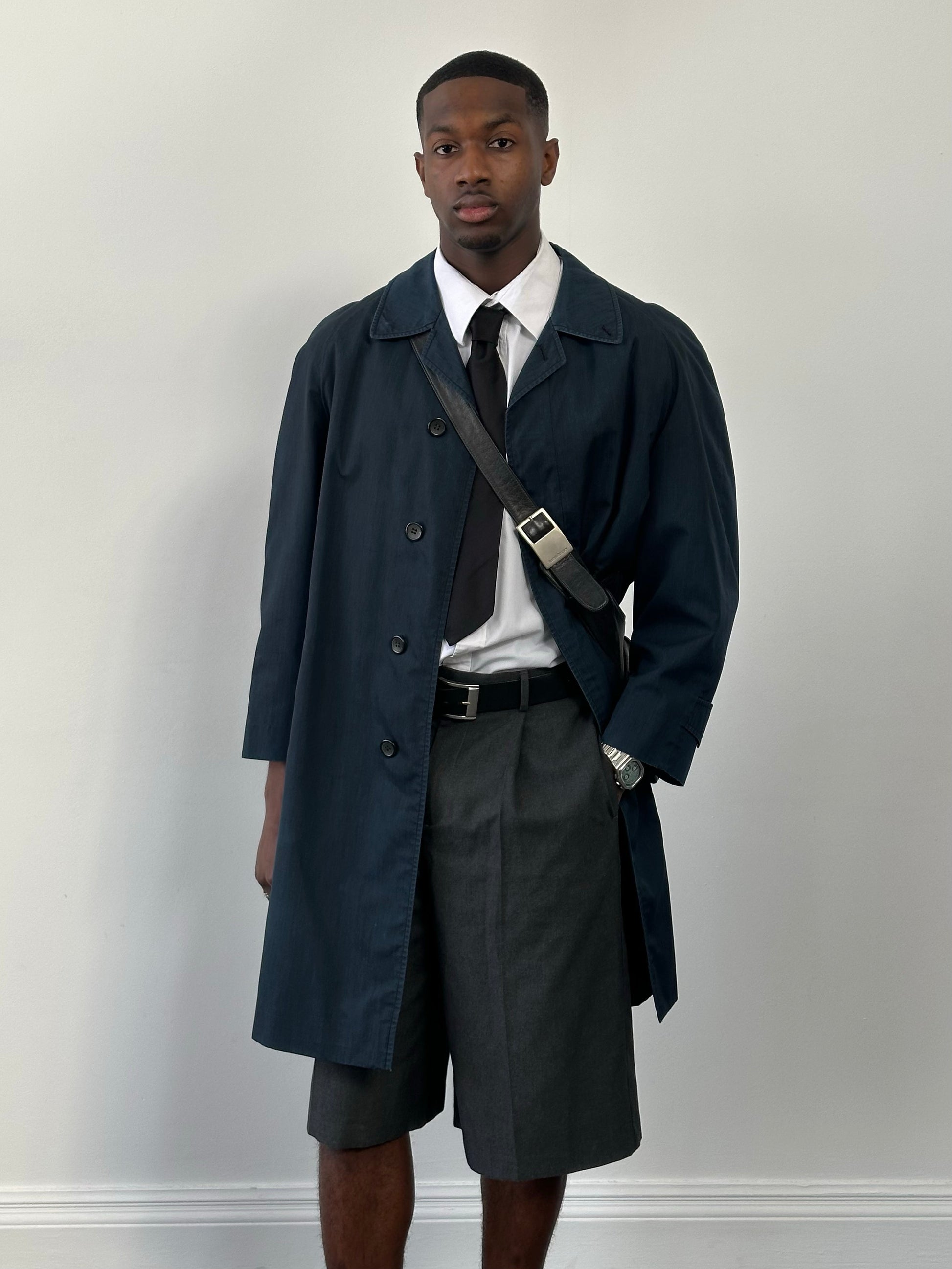 Burberry 1990s high neck trench coat with concealed placket in beige, showing the classic tailored fit and collar detail.