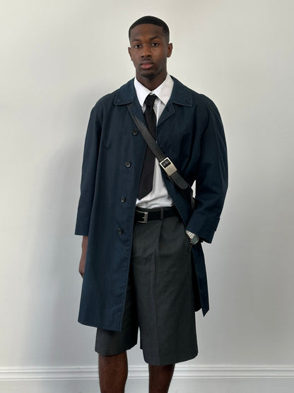 Burberry 1990s high neck trench coat with concealed placket in beige, showing the classic tailored fit and collar detail.