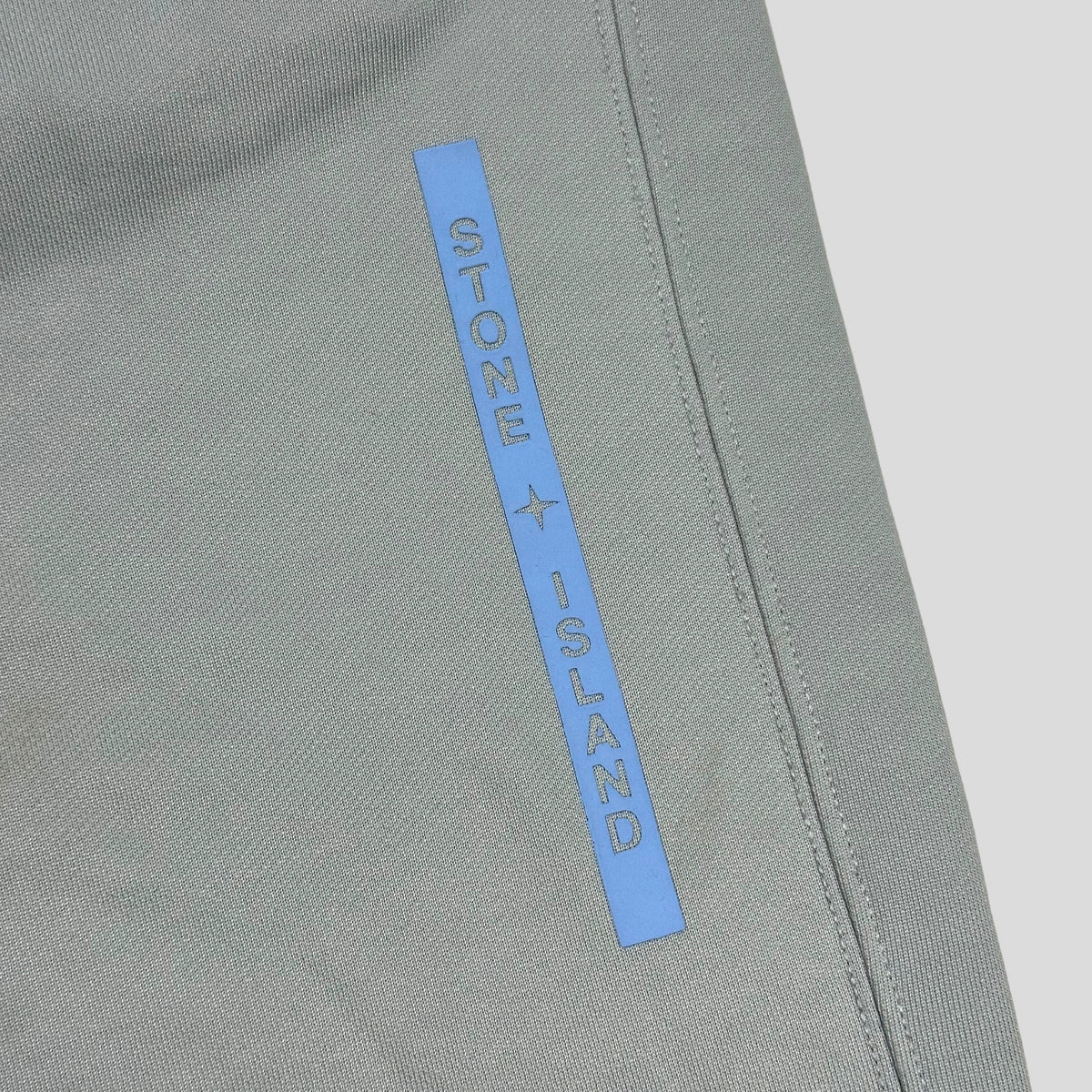 Stone Island AW22 Micrographic Spellout Logo Baby Blue Joggers - XL | XL, Blue