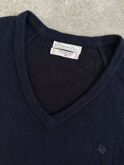 Christian Dior 1990s V-neck logo jumper in black and white, featuring the Dior logo, displayed on a mannequin.
