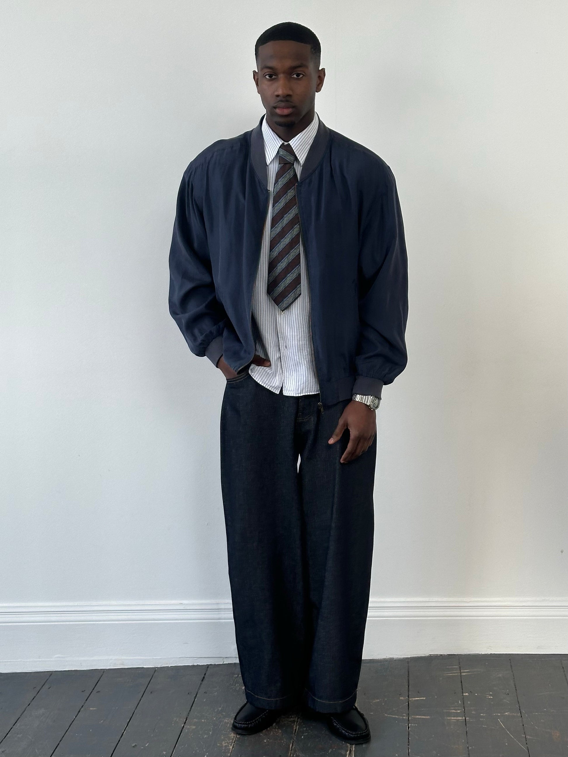 Vintage 1990s pure silk boxy bomber jacket in classic style, featuring a relaxed fit and lightweight fabric, front view image.