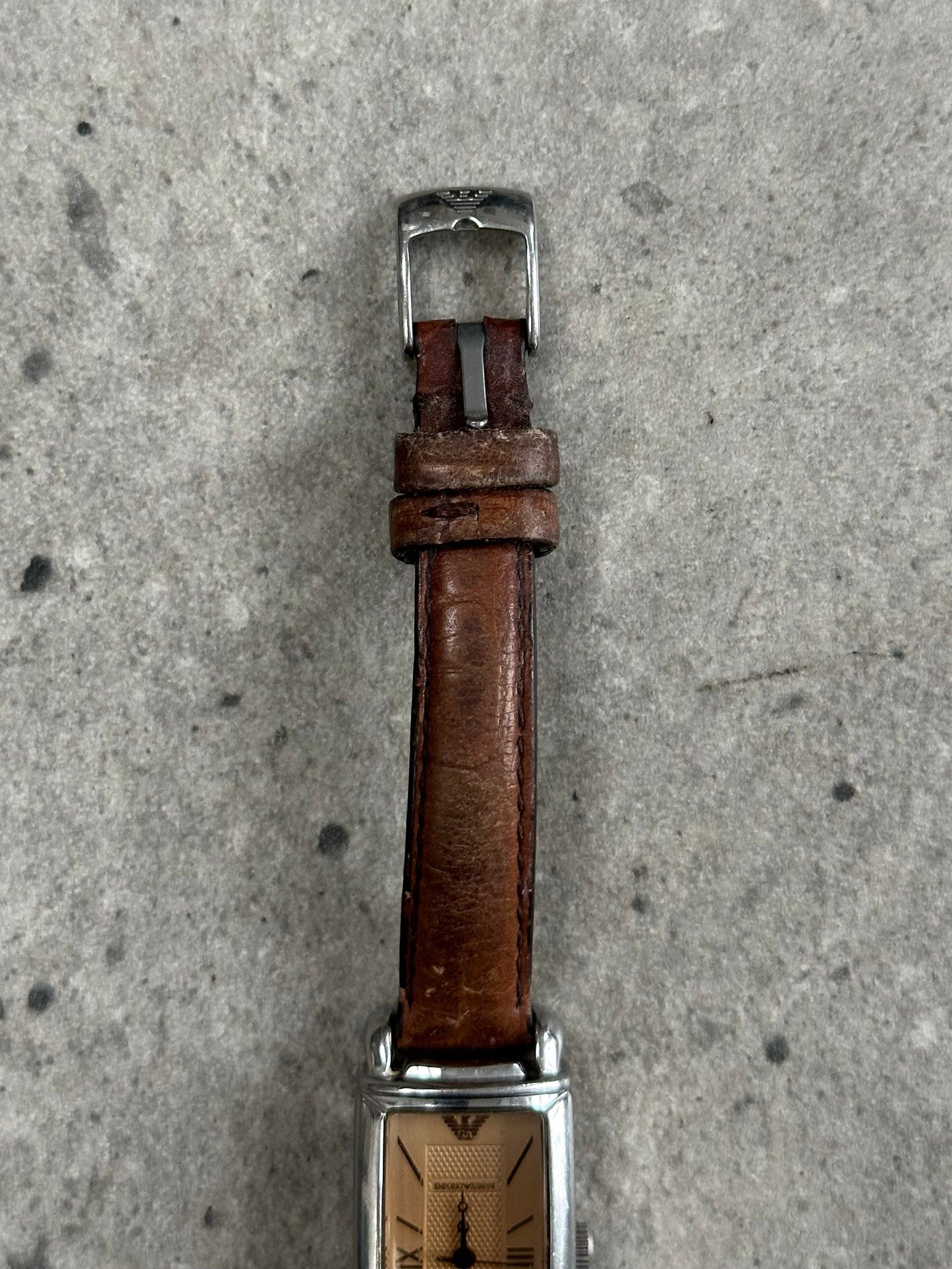 Emporio Armani 2000s leather watch with classic design, featuring a round dial and leather strap, stylish and sophisticated.