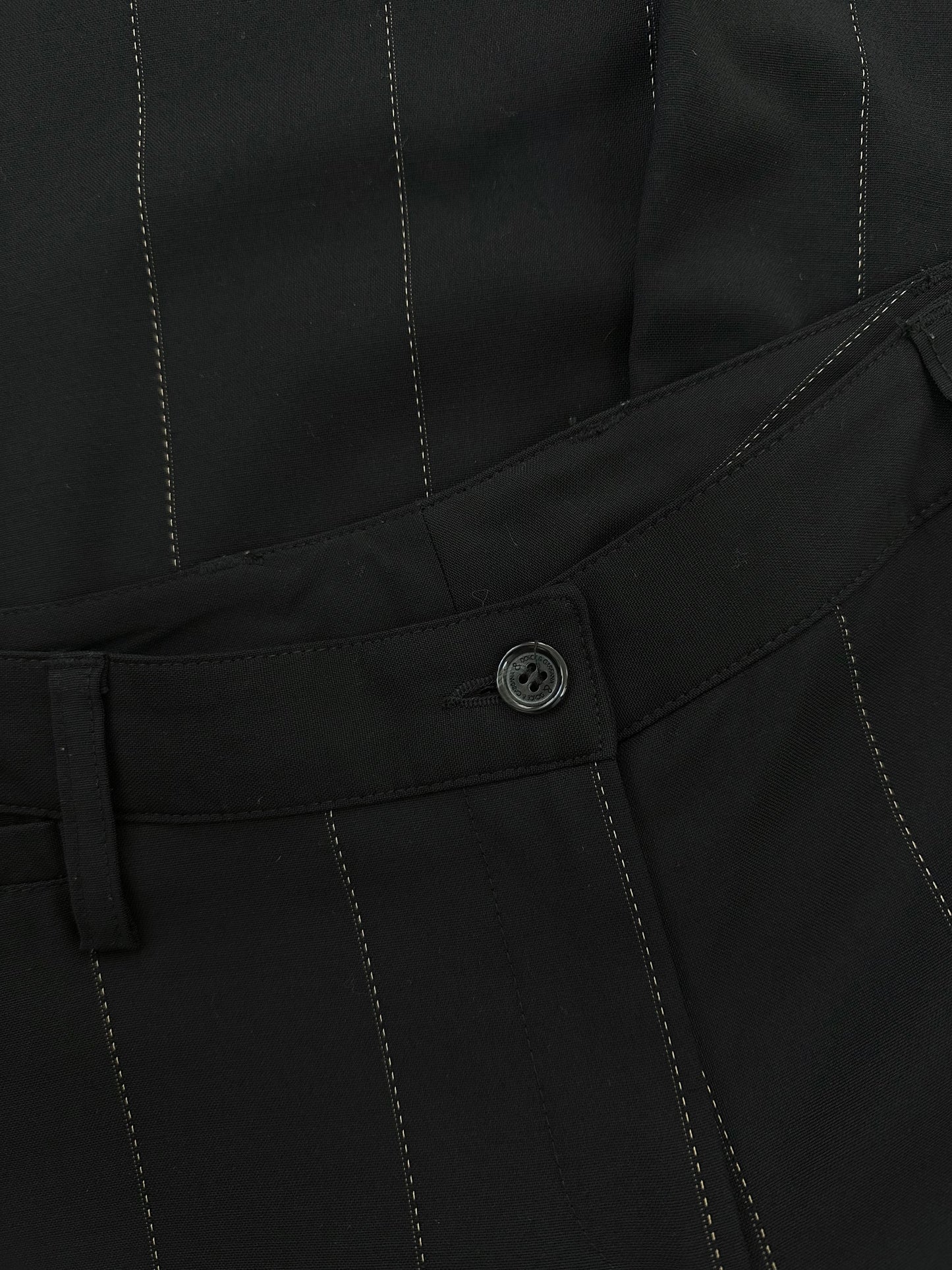 Dolce & Gabbana 2000s wool trousers in size W28, featuring a classic tailored fit and neutral color.