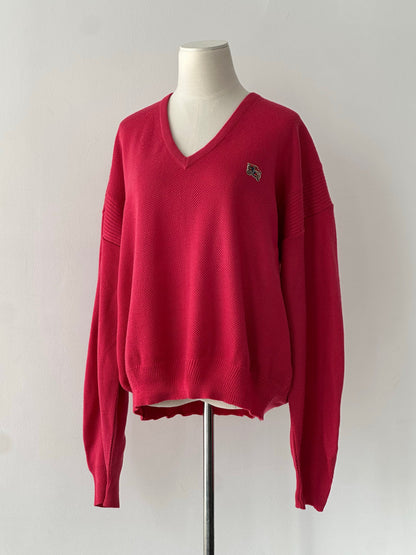 Burberry 1980s V neck logo knit jumper in size L, featuring classic Burberry pattern and ribbed V neckline on a model.