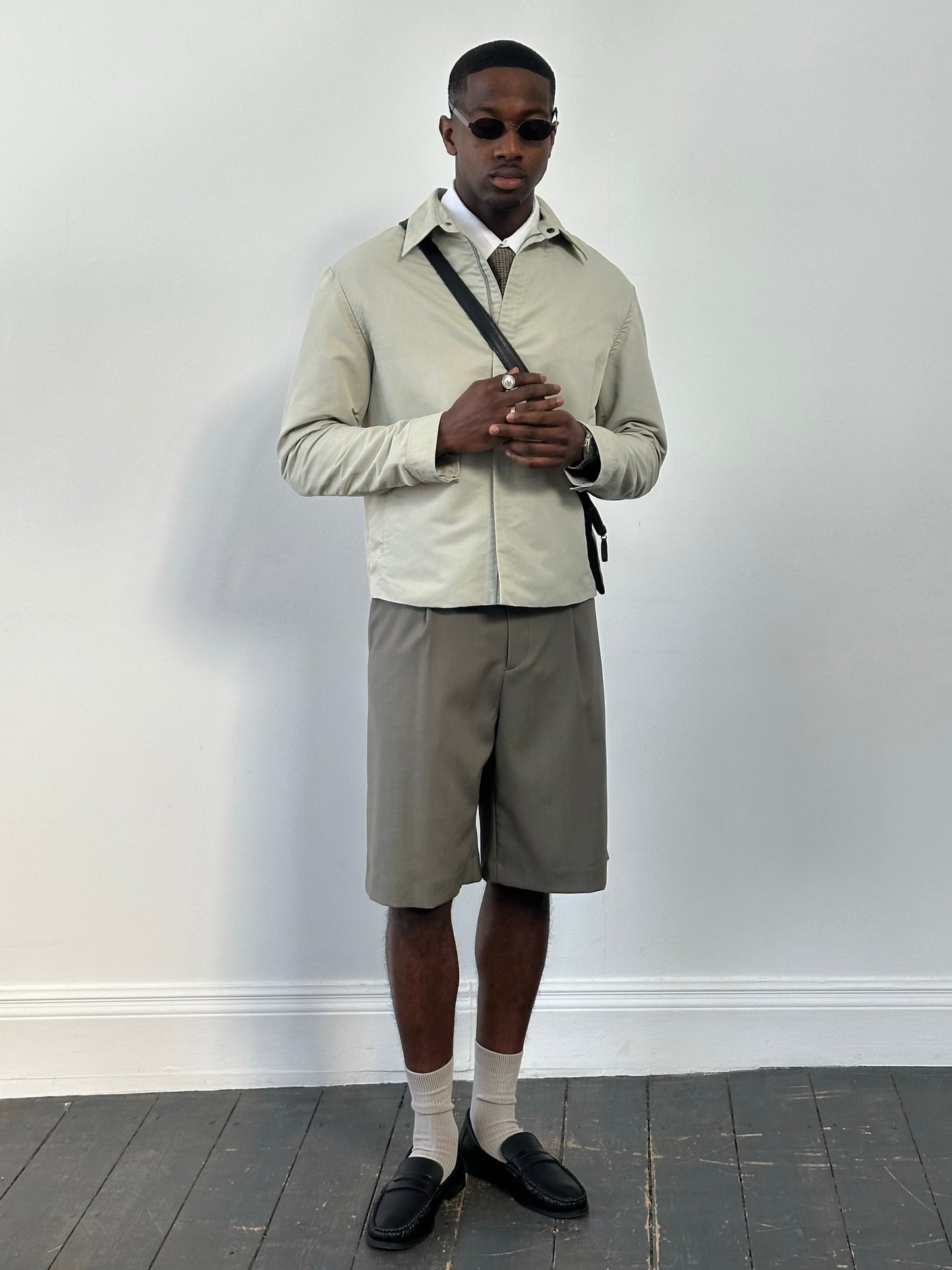 Gianfranco Ferre 1990s showerproof minimal jacket in size L, lightweight jacket with sleek design and waterproof fabric.
