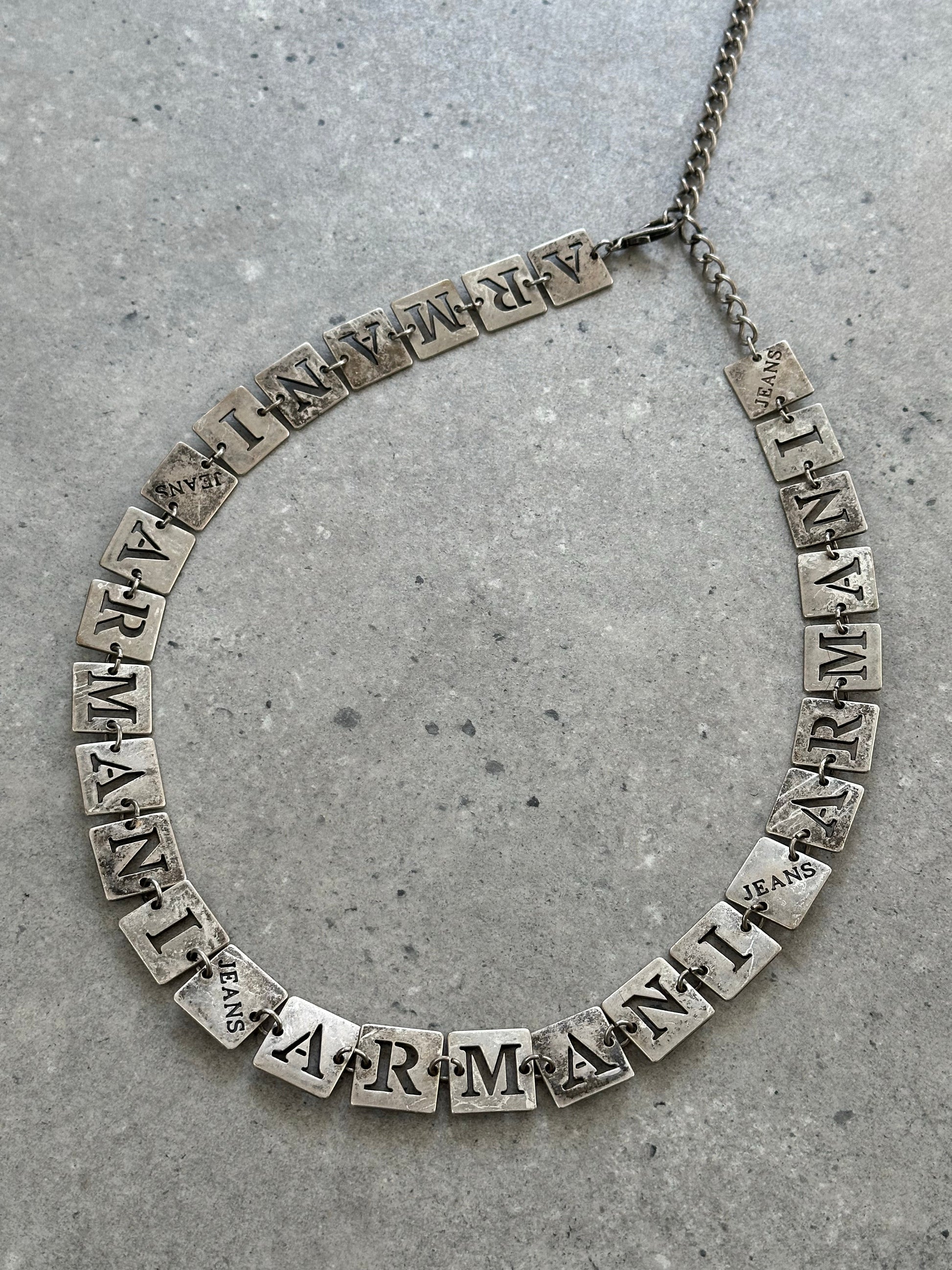 Armani Jeans 1990s monogram chain belt, one size, featuring metallic chain design and branded logo details.