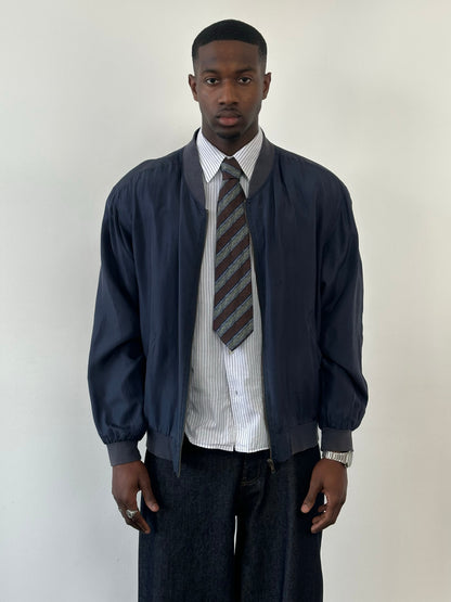 Vintage 1990s pure silk boxy bomber jacket in classic style, shown in a natural pose with front view.