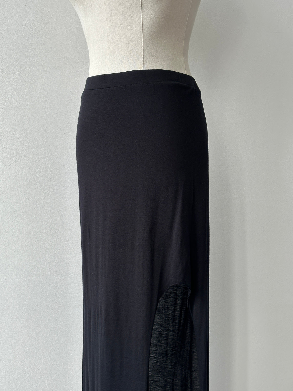 Helmut Lang 2000s side split maxi skirt in black, flowing fabric with high slit, displayed on a mannequin.