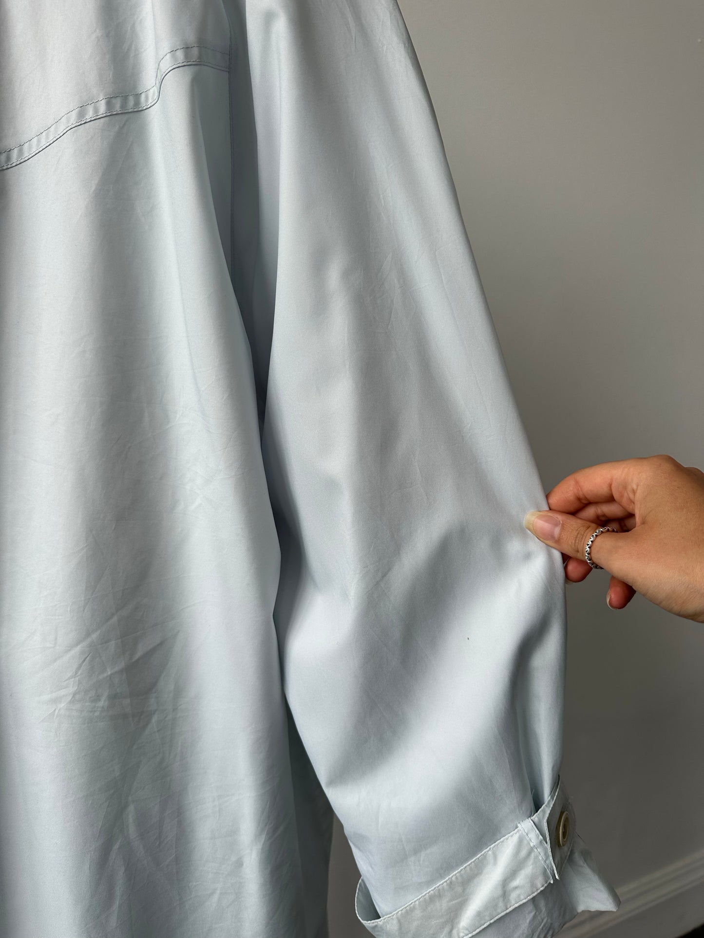 London Fog 1990s trench coat in XL with concealed placket, classic beige color, shown on a hanger.