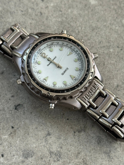 Vintage 1990s Titanium Quartz Sports Watch with black dial, stainless steel band, and chronograph features.