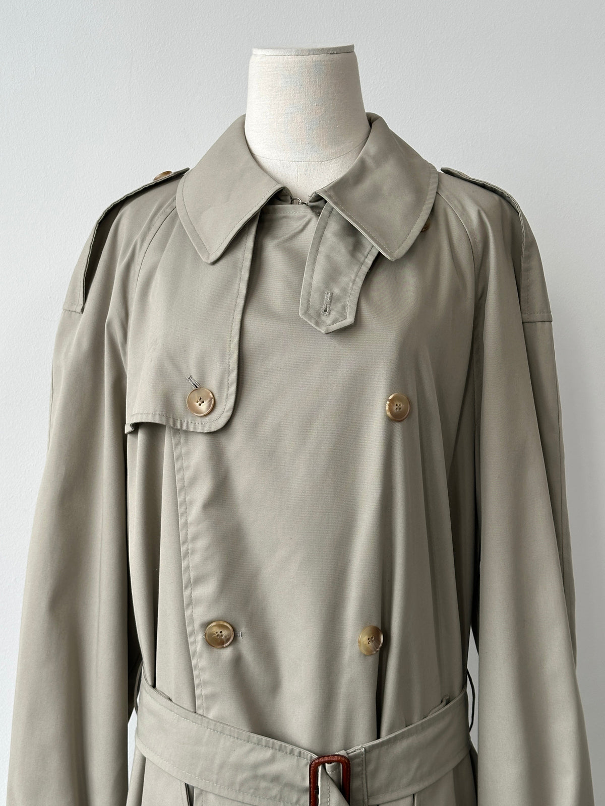 Vintage Italian 1990s high neck belted trench coat in XL, showing the classic design and structured silhouette.