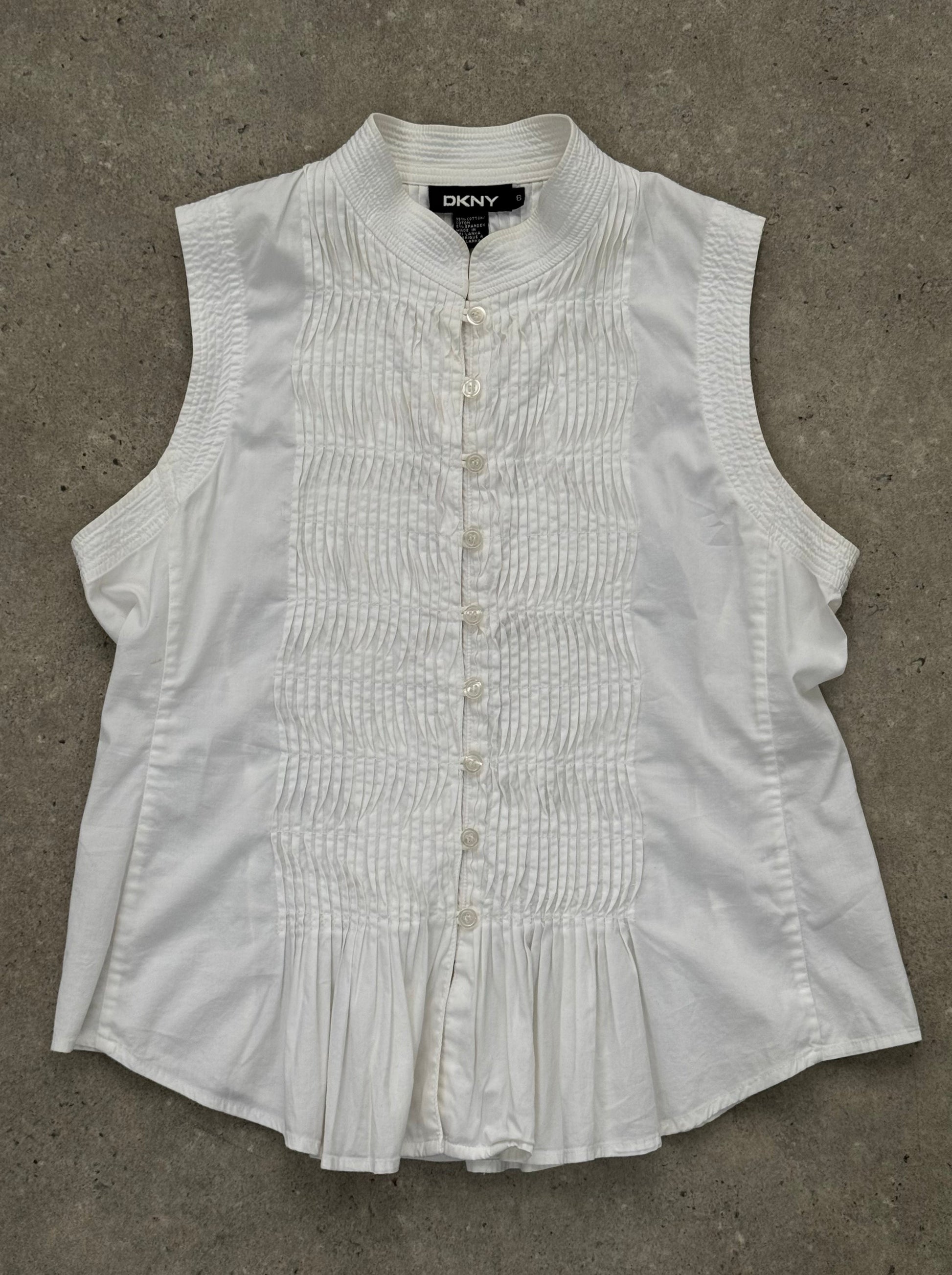 DKNY 2000s pleated sleeveless cotton top in size M, featuring a classic design with pleats and a sleeveless silhouette.