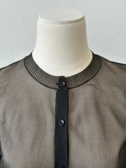 DKNY 1990s sheer knit cardigan in size S, featuring lightweight, transparent fabric and classic design, displayed on a hanger.