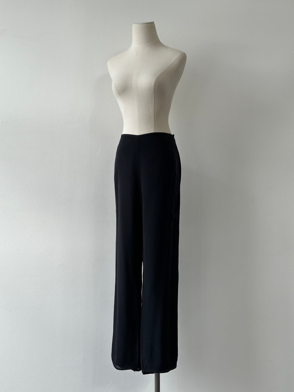 Vintage 1990s pure silk wide leg trousers in size W30, showcasing elegant flowy fabric and classic wide-leg style.