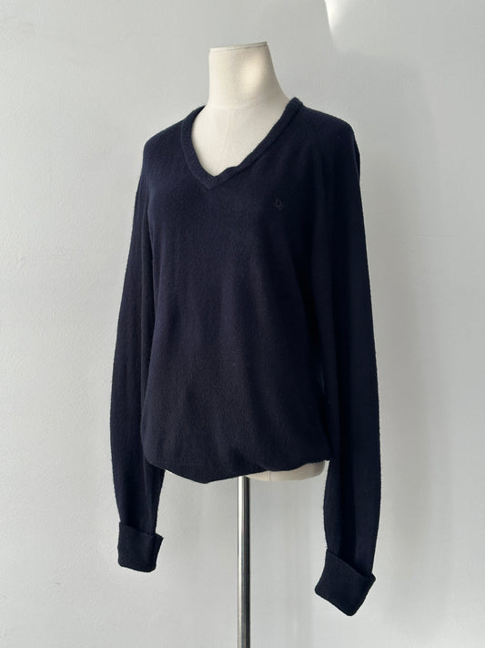 Christian Dior 1990s V-neck logo jumper in black, featuring the iconic Dior branding and classic fit, styled on a mannequin.