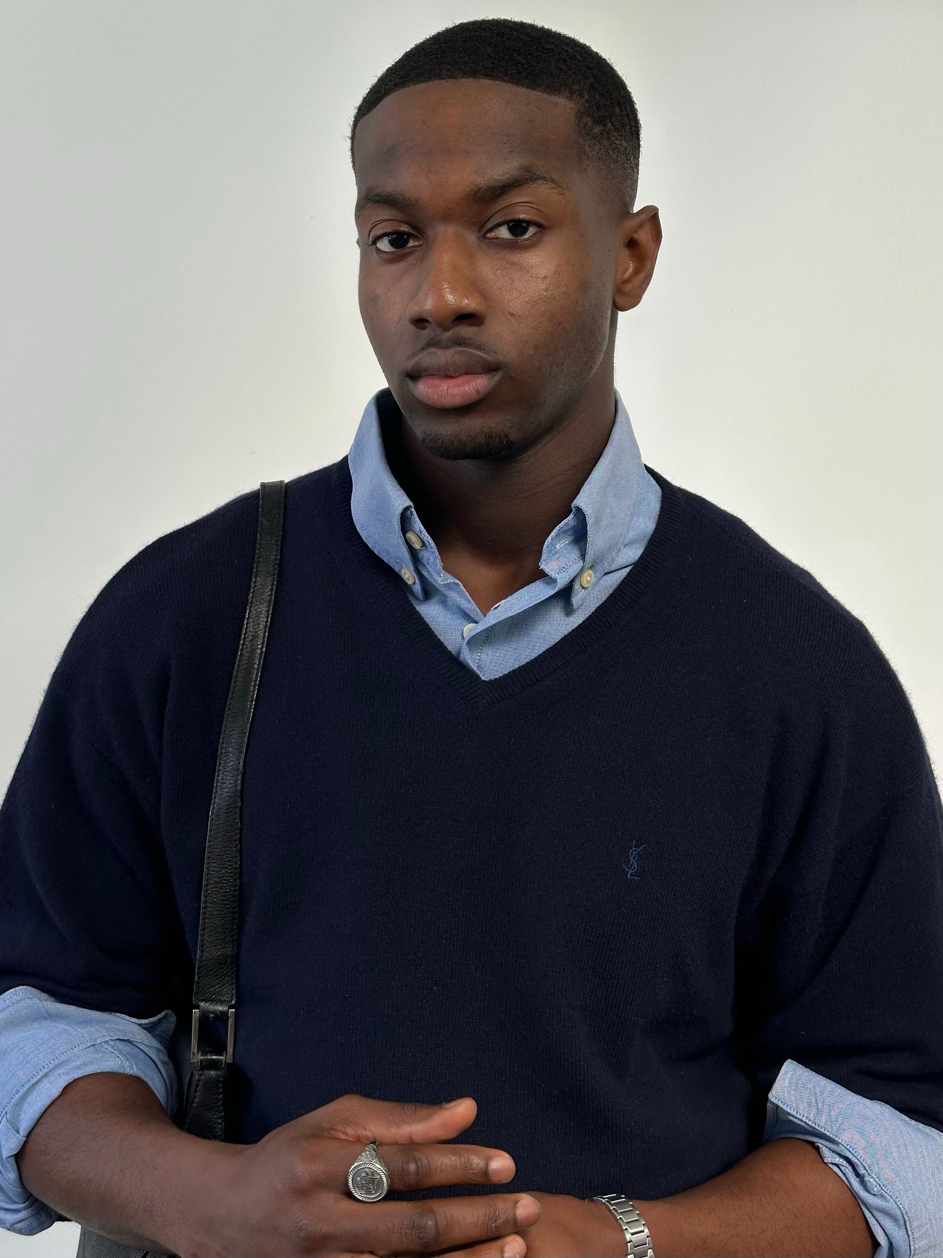 Yves Saint Laurent Pour Homme 1990s wool V-neck jumper in size L, navy blue sweater displayed on a hanger.