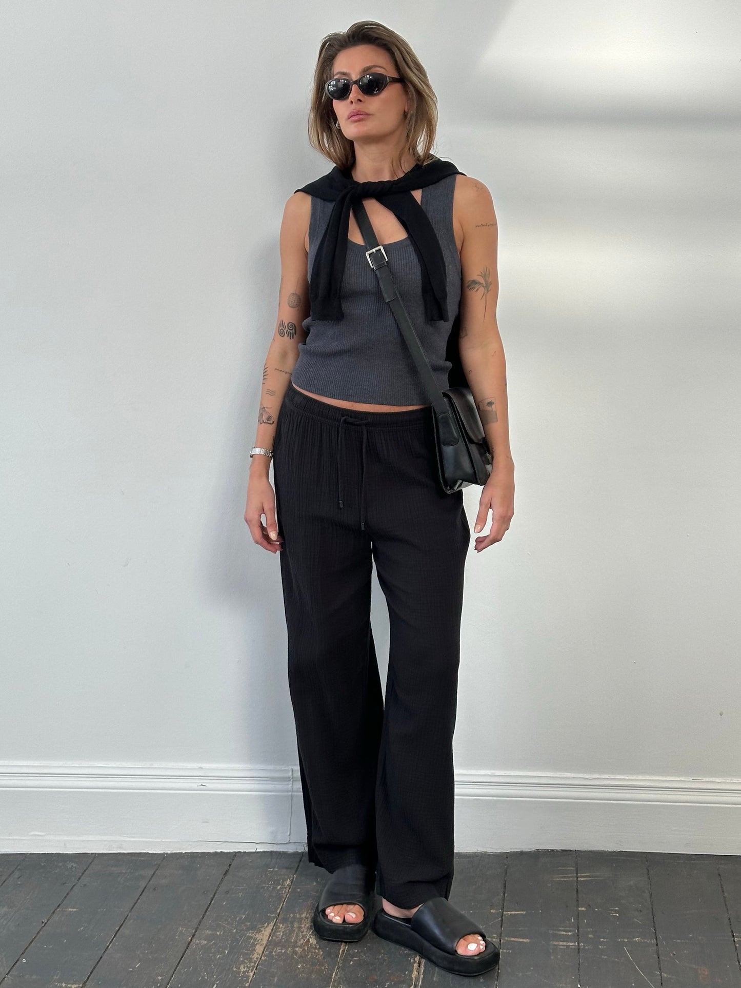 DKNY beachwear wide leg cotton trousers in natural color, featuring a relaxed fit and high waist, perfect for casual summer wear.