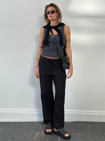 DKNY beachwear wide leg cotton trousers in natural color, featuring a relaxed fit and high waist, perfect for casual summer wear.