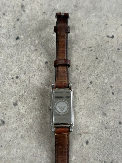 Emporio Armani 2000s leather watch with black dial, silver case, and leather strap, showcasing classic watch design.