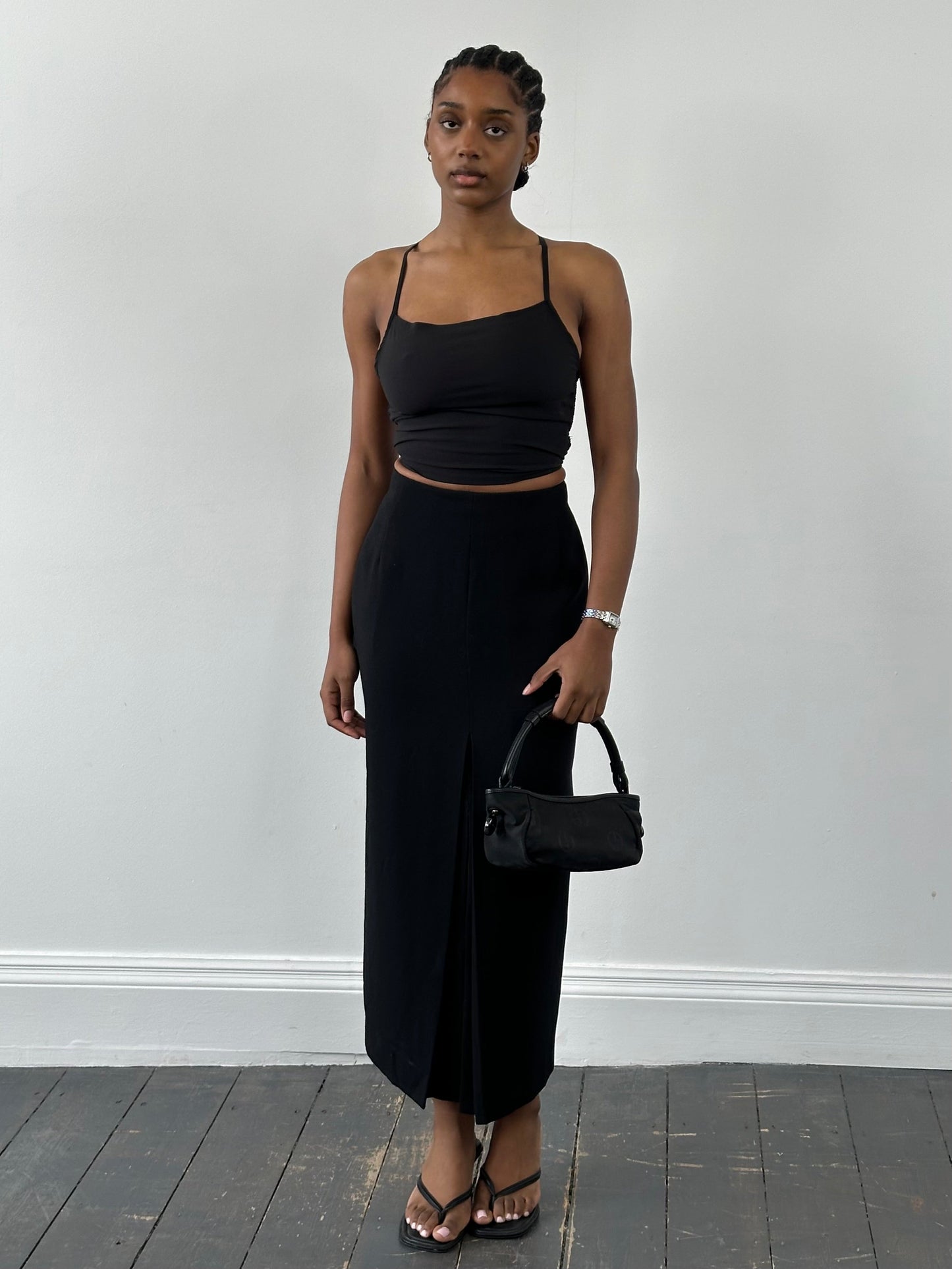 Jaeger 1990s pure wool side split maxi skirt in gray, showing the flowing fabric and side slit detail.