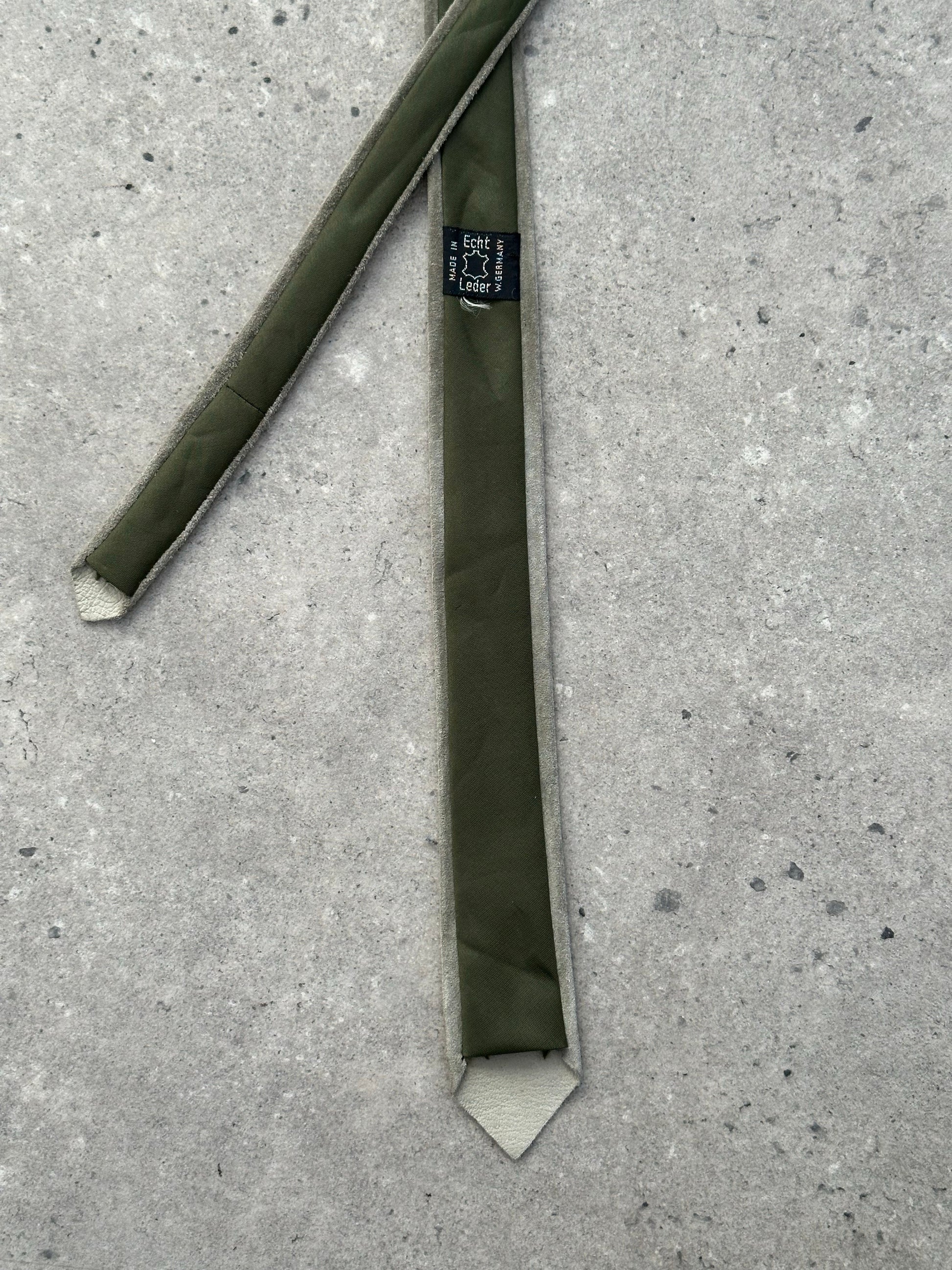 Vintage 1990s suede skinny tie, stylish accessory with textured suede fabric and narrow design, ideal for retro fashion looks.