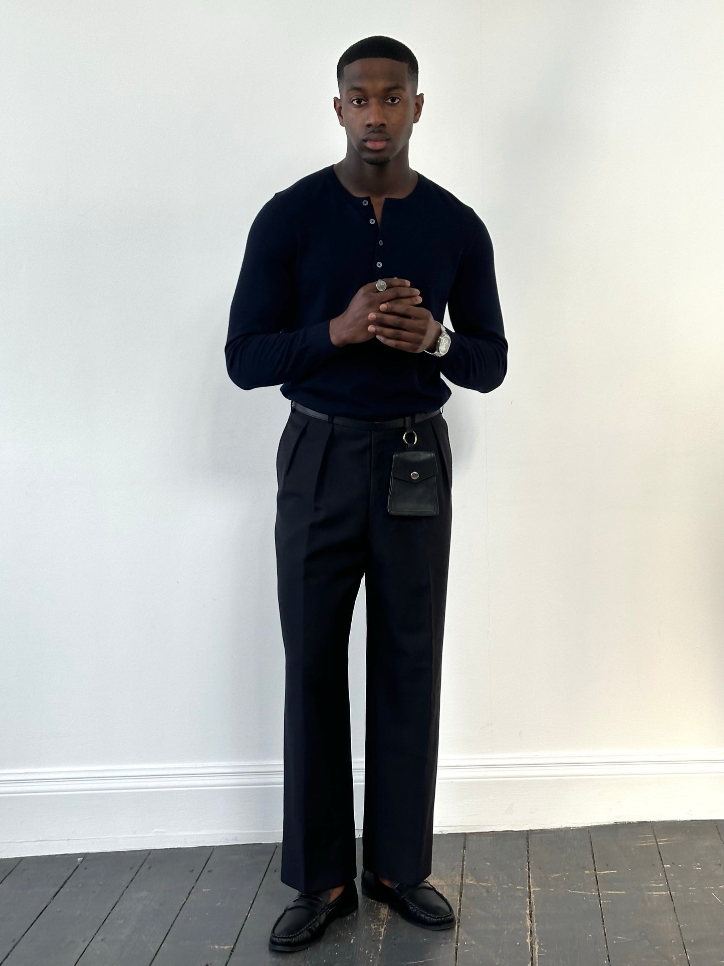 Vintage 1990s wool mohair pleated trousers in size W34, displayed flat showing the high-waisted design and classic fabric texture.
