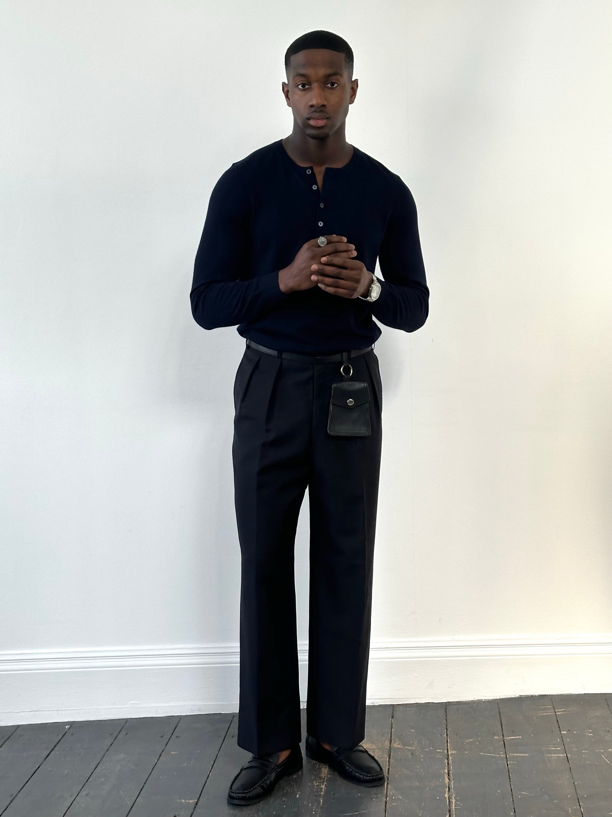 Vintage 1990s wool mohair pleated trousers in size W34, displayed flat showing the high-waisted design and classic fabric texture.