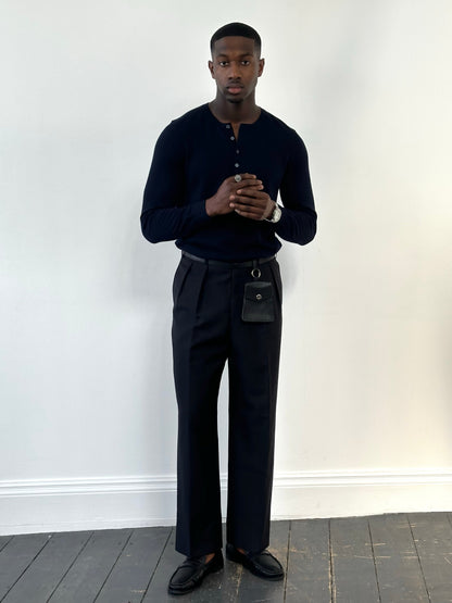 Vintage 1990s wool mohair pleated trousers in size W34, displayed flat showing the high-waisted design and classic fabric texture.