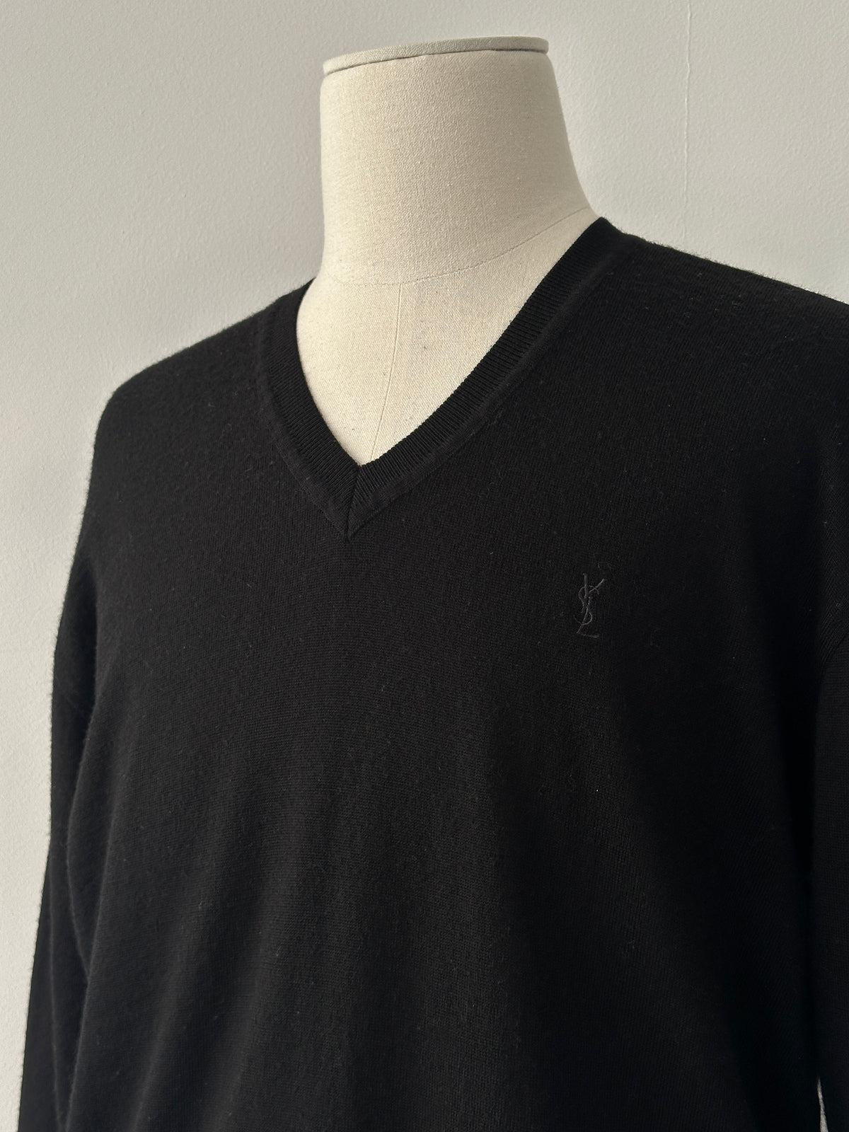 Yves Saint Laurent 1990s pure wool V-neck jumper in size M, shown in beige with a classic fit and ribbed collar detail.