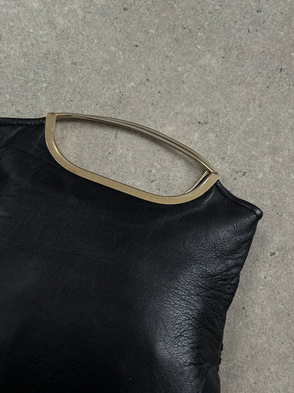 Vintage 1990s leather handbag with classic design, featuring a structured shape and vintage brand accents.