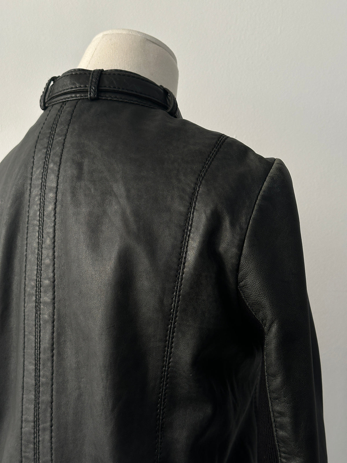 Vintage 2000s fitted moto leather jacket in lamb leather, XS size, featuring classic design and detailed stitching.