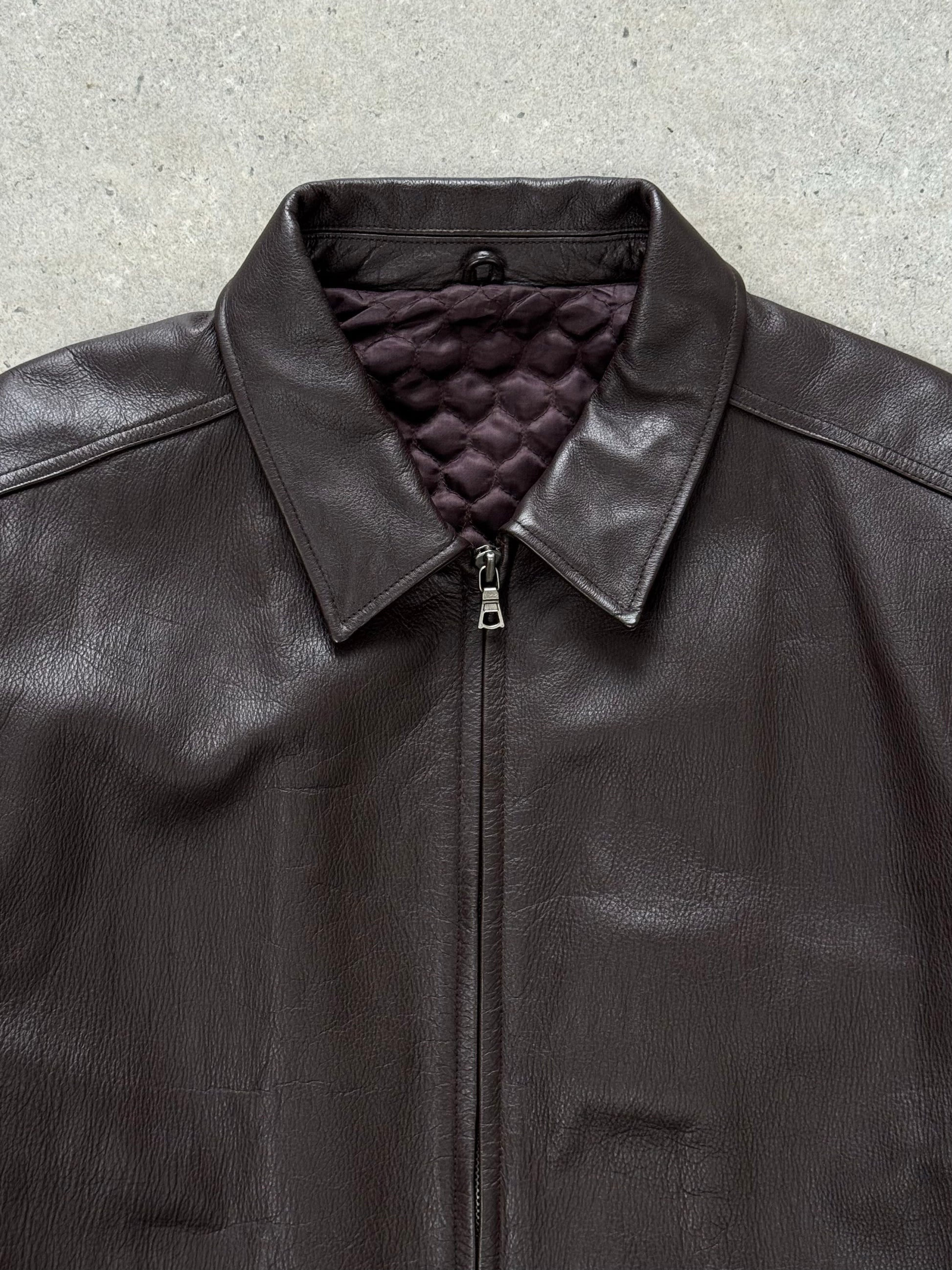 Vintage 1990s boxy minimal leather jacket in XL, featuring a classic design with clean lines and authentic leather texture.