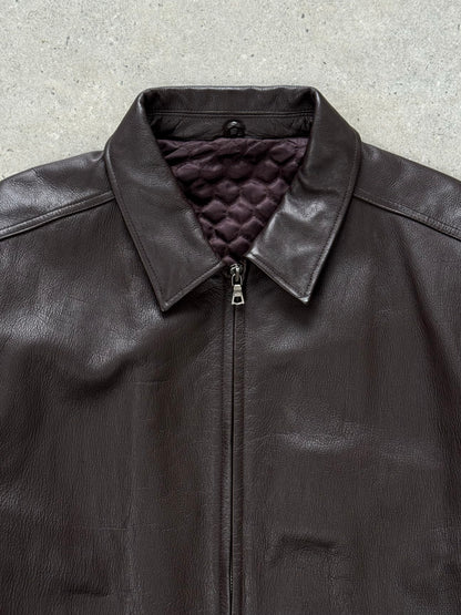 Vintage 1990s boxy minimal leather jacket in XL, featuring a classic design with clean lines and authentic leather texture.