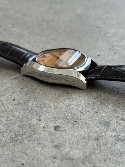 Emporio Armani leather quartz watch from the 2000s with a sleek design and classic round dial, showcasing elegant craftsmanship.